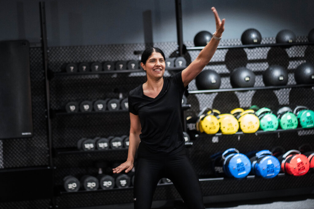Image showing a woman taking place in a low-intensity workout class, suitable for those taking part in Ramadan.