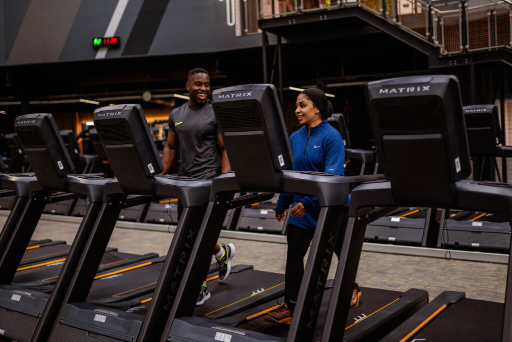 Image showcasing two people training at JD Gyms, promoting their open weekend.